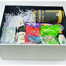 white textured gift box with items packed in .