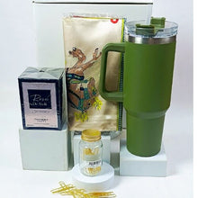 A perfume, silk scarf, Office clips and Green quencher bottle with a white gift box. Displayed on a white background