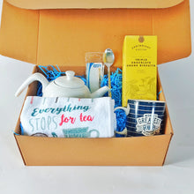 Fathers day brown box with white tea pot  tea towel tweezers  teaspoon , cartright & Butler Biscuits  and Tea bags