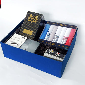 Blue gift BOX FOR MEN. Containing A pavk of handkerchiefs, a manicurevset  A pair of colour pallet style cufflinks and a bottle of perfume