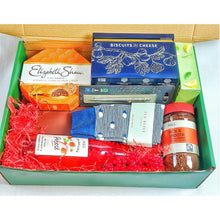 Green Christmas box Hamper filled with red shredded paper, with Gourmet snacks , Coffee,  biscuits for cheese, Sparkling Fruit Presse and Green Tea