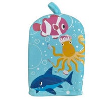 Children's bath mitt with ocean-themed design featuring a shark, fish, and octopus on a blue background.