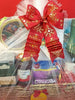 Elegant Christmas hamper with handwoven basket, tulle wrap, and festive bow
