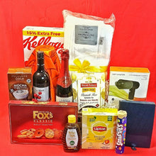 Assorted groceries including Kellogg's cereal, La Martinière wine, and Lipton tea on a red background