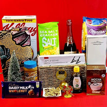 Assorted items including a laptop stand, snacks, and a bottle on a red background
