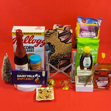 Festive Balance Gift Hamper with treats, honey, tea, wine, Laptop stand & breakfast essentials displayed