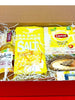 Gift box with Belvoir Farm lemonade, Sea Salt crackers, Lipton tea, and a wooden ornament.