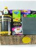 A wicker hamper basket containing a variety of items including a prayer mat, tasbih, fabric, and leatherette notepad.