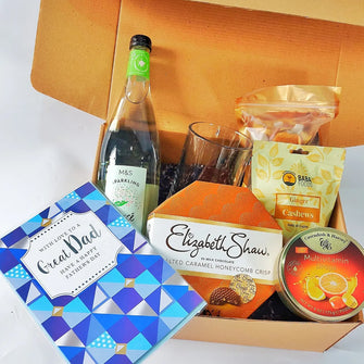 Light Brown Giftbox for men with a fruit presse drink, Ginger Cashews, tropical Dried fruits   Fruit candy, Honey comb Crisps and a fathers day card