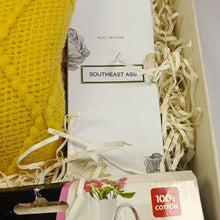 Close up of box contents. With focus on a white packaging box for diffuser