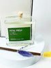 Aroma home fragrance diffuser labeled 'Petal Fresh' with a wooden stick and fluffy ends on a white background.