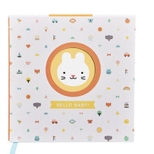Baby journal with a white background with bunny and kids decorative hard back cover. 
