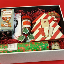 Premium festive chest with gourmet treats and elegant holiday items”