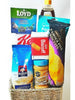 A mini raffia basket hamper with treats and drinks great for Ramadan 