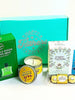 The Gentle Giant Father's Day gift box featuring grooming essentials, organic tea, premium chocolates, a scented candle, and heartfelt appreciation cards arranged in a luxury gift box.