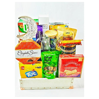 A selection of food items and other goods packaged in a white gift box, labeled as the Sabreen Selection Box.
