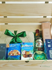 Luxury Father's Day gift crate in a natural wooden keepsake box featuring a knitted comfort item with green ribbon, premium mixed nuts, fudge chocolates, mint drops, Hareem Istanbul clove diffuser, whiskey glass, refreshments and gourmet treats for dads and father figures.