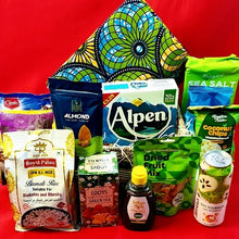 Assorted groceries including rice, tea, and snacks on a red background