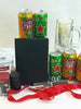 Luxury men's gift hamper featuring imported beer cans, a custom notebook, mahogany pen set, beer tankard, bottle opener, gourmet snacks, and Father's Day keepsakes.
