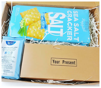 The Men's Socks & Cracker Gift Box. A brown gift box with a blue theme. Containing a big pack of Peppito crackers, Tetley Decaff Tea and a 5pcs Box of socks