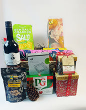 Handwoven basket chrisrmas hamper with crackers, home fragrance,  wine, Ash try, an African print fabric, honey coated cashews, Baylis & Harding stacked gift box set. Great Christmas gift 