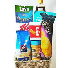 A mini raffia basket hamper with treats and drinks great for Ramadan 