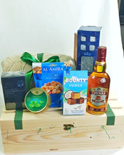 Premium Father's Day gift crate arranged in a natural pine wooden box with a green ribbon, gourmet almonds, fudge chocolates, mint drops, men's grooming products, whiskey glass and premium refreshments for dads and father figures.